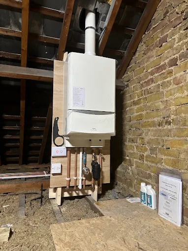 Loft boiler installation with new fused spur and neat electrical connections by JM Electrical